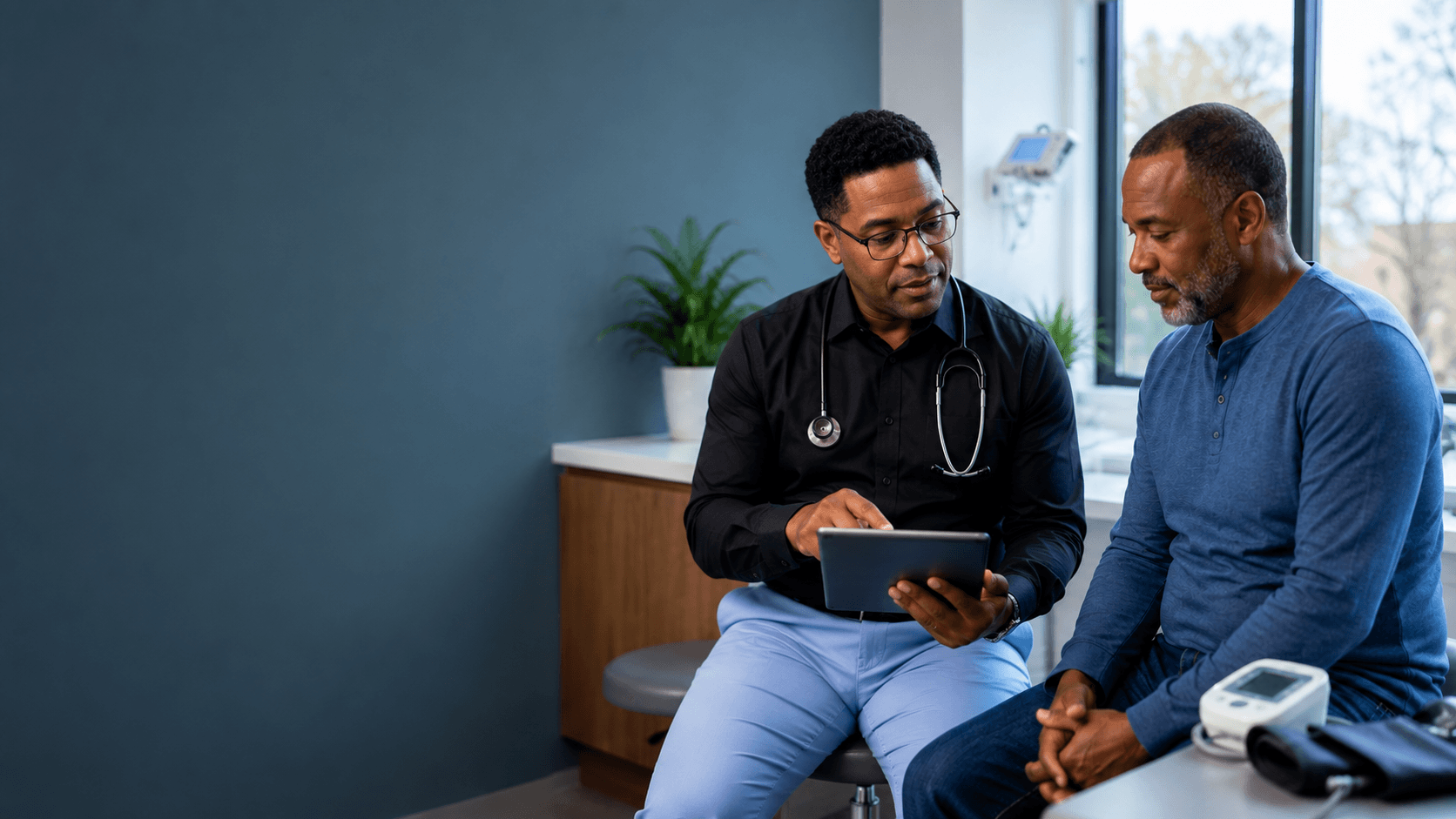Family physician reviewing an ongoing chronic disease care plan with a patient